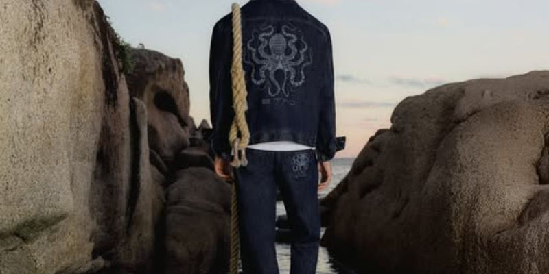 Etro Fall 2020 image in front of wooden doors.