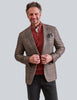 Man wearing chocolate brown plaid jacket with orange highlights from M PENNER in Houston, Texas